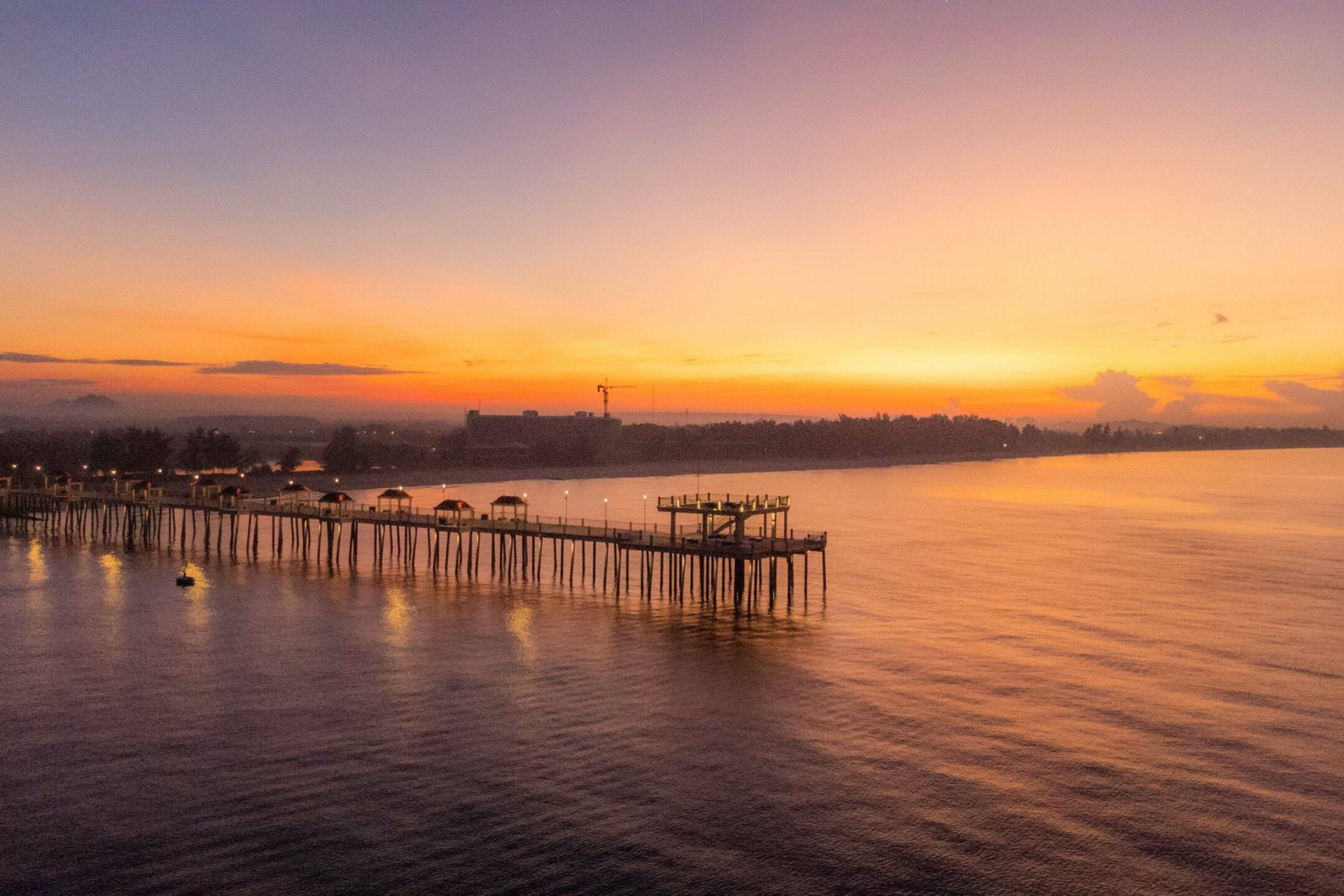 Seaside pier at sunset.